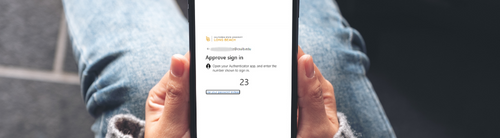 Person holding phone screen with passwordless log in