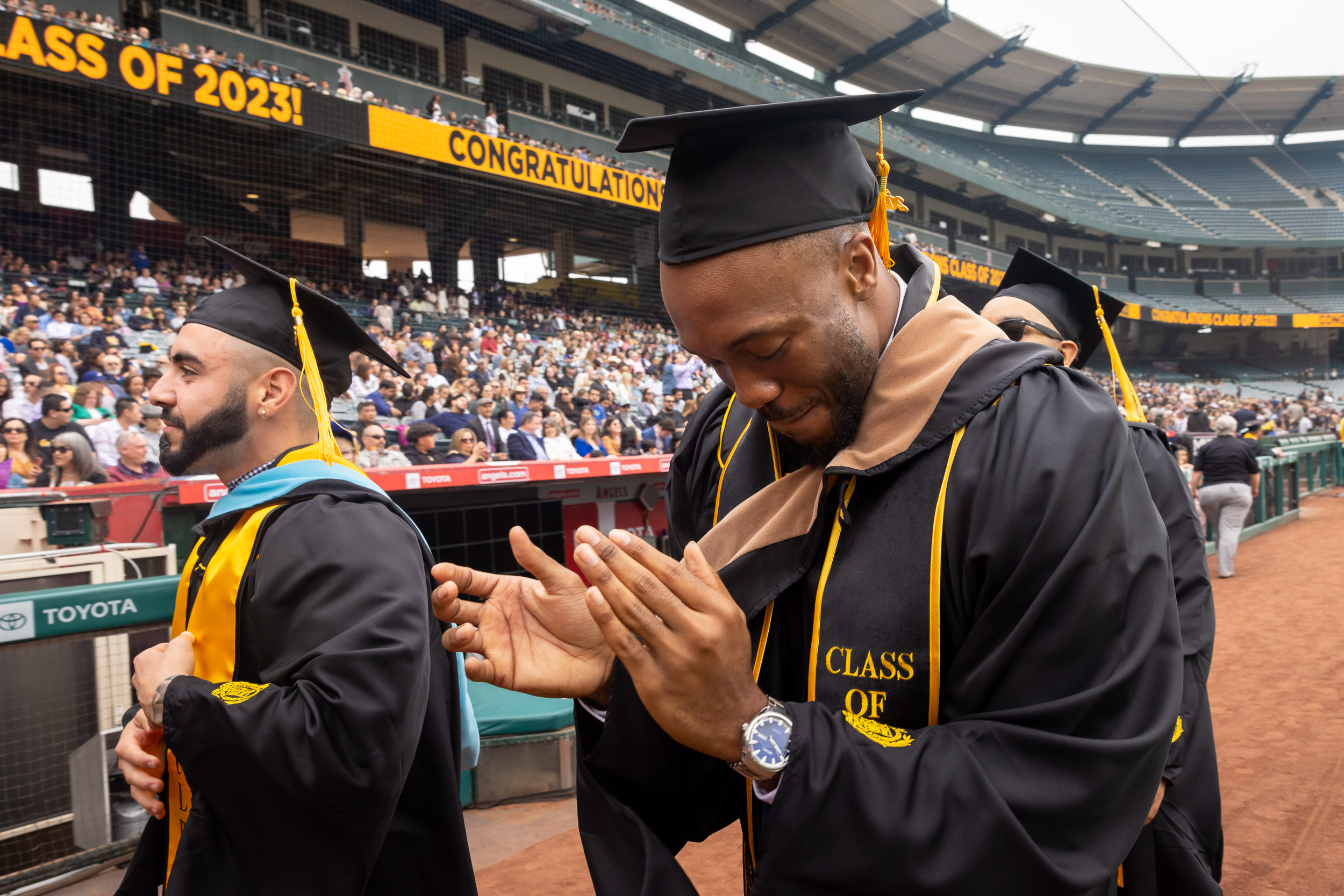 Masters grad clapping