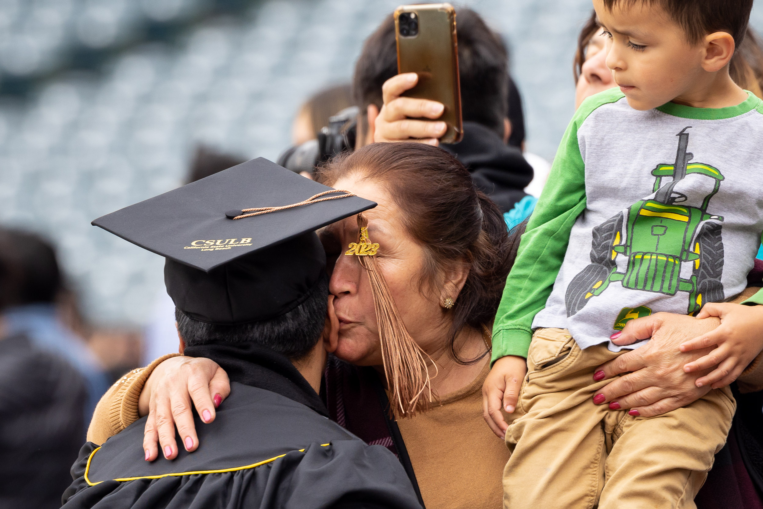 Mother kisses son