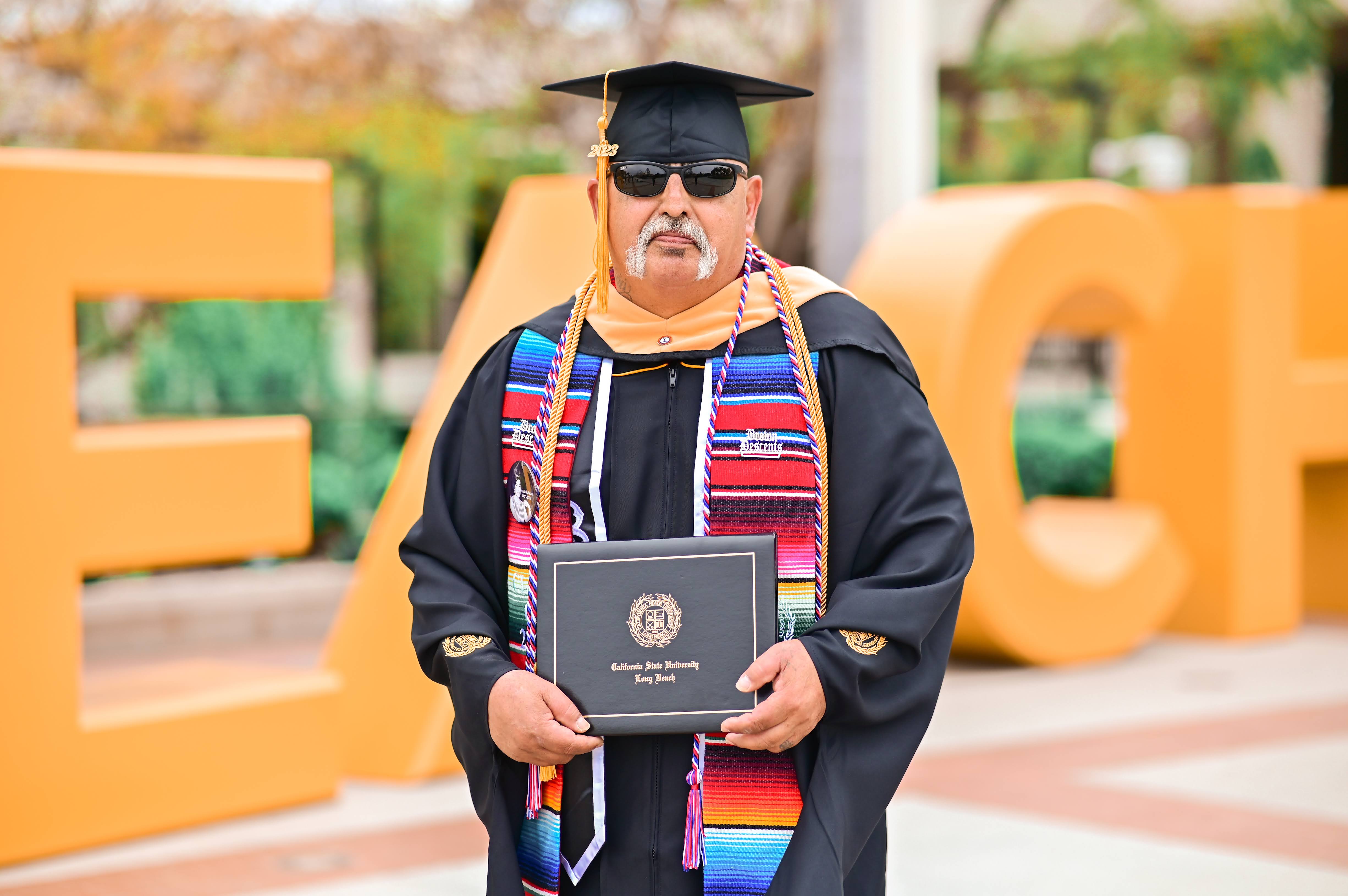 Joseph Valdez with diploma