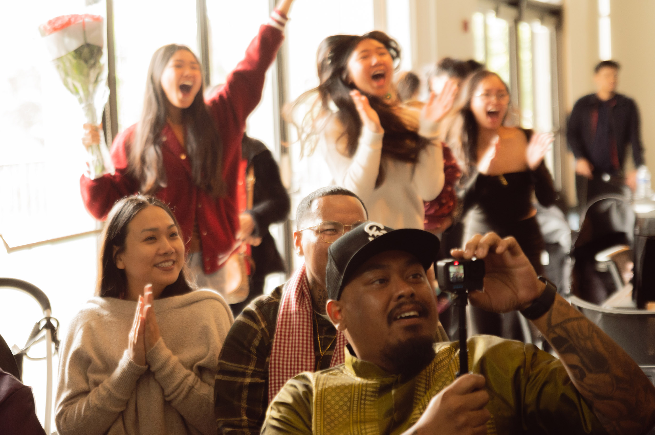 Students cheer on graduate