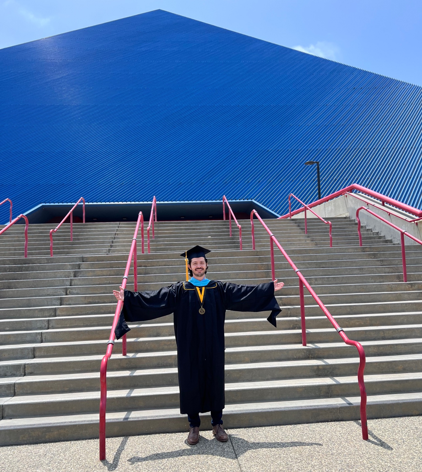 Mario Jaramillo poses in front of the Walter Pyramid