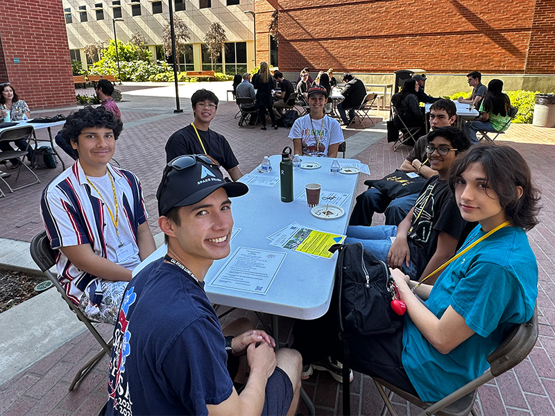 young data day participants having lunch outside
