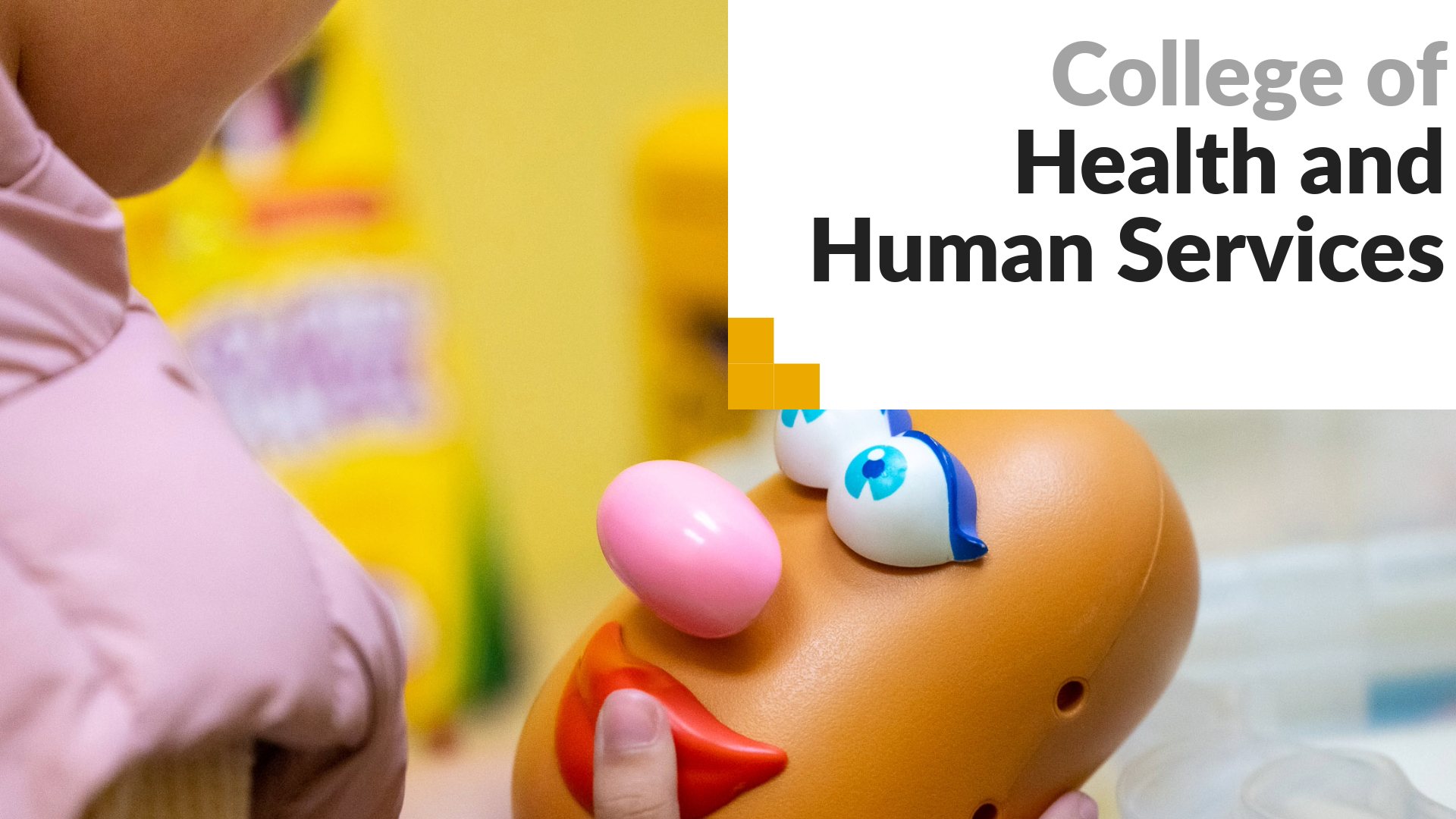 College of Health and Human Services. A young girl holds a Mr. Potato Head toy in a speech therapy clinic. 