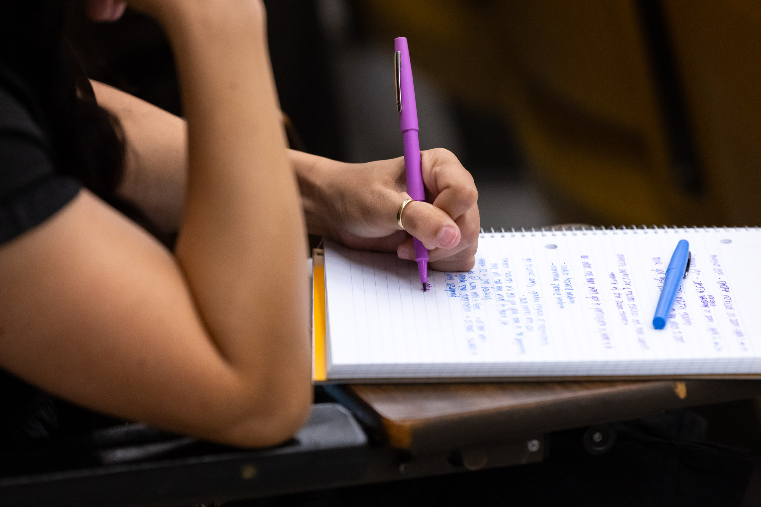 student taking notes