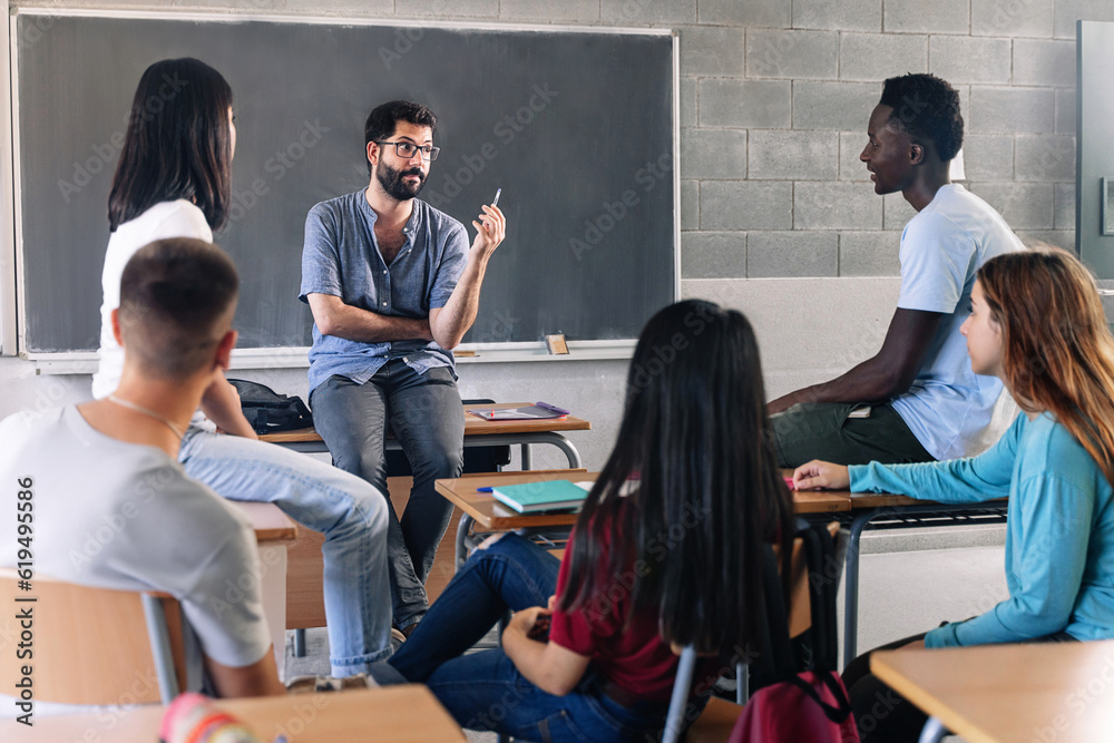 A teacher with students in a classroom.