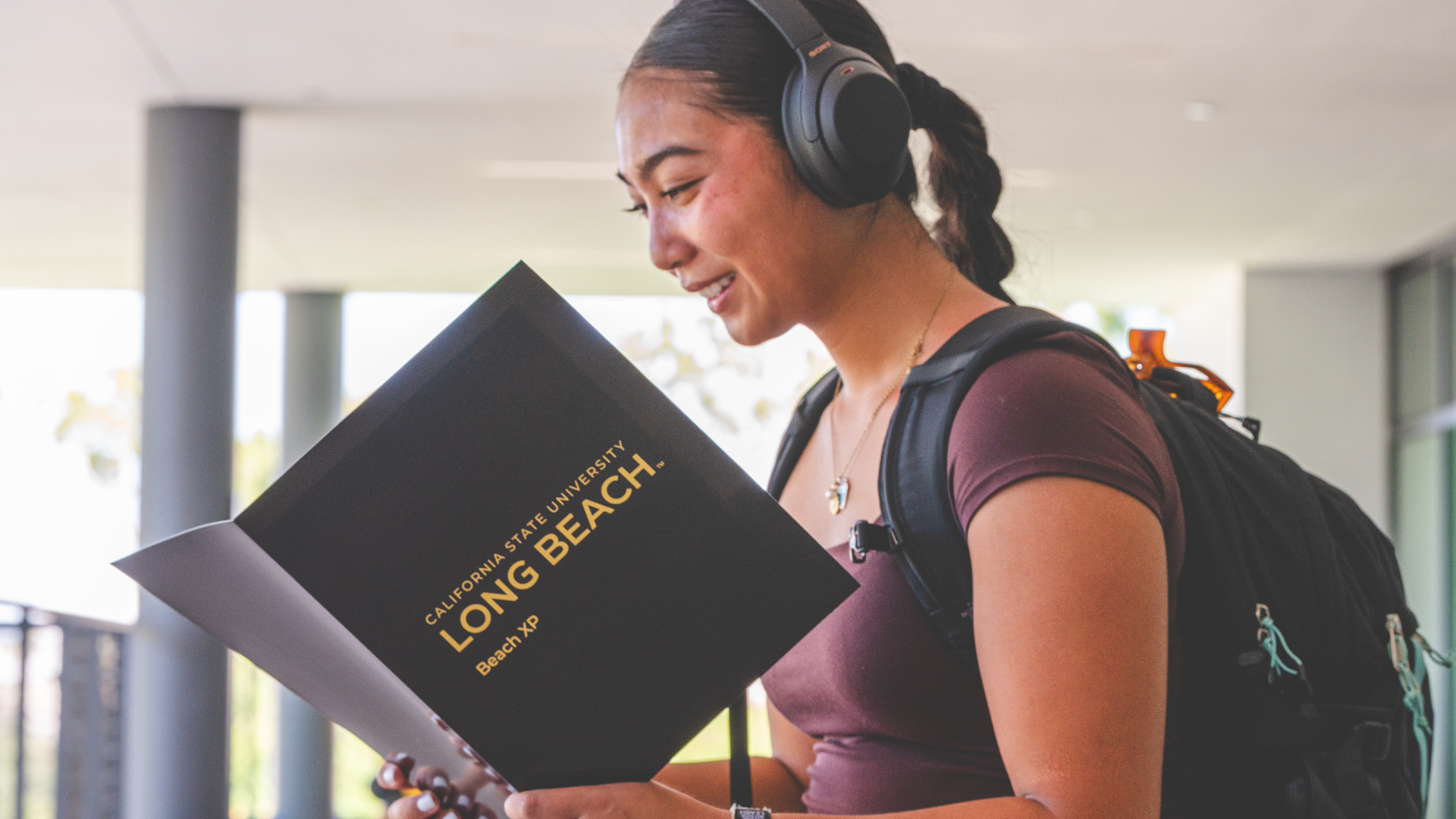 A student looks over her Beach XP folder on the first day of classes.