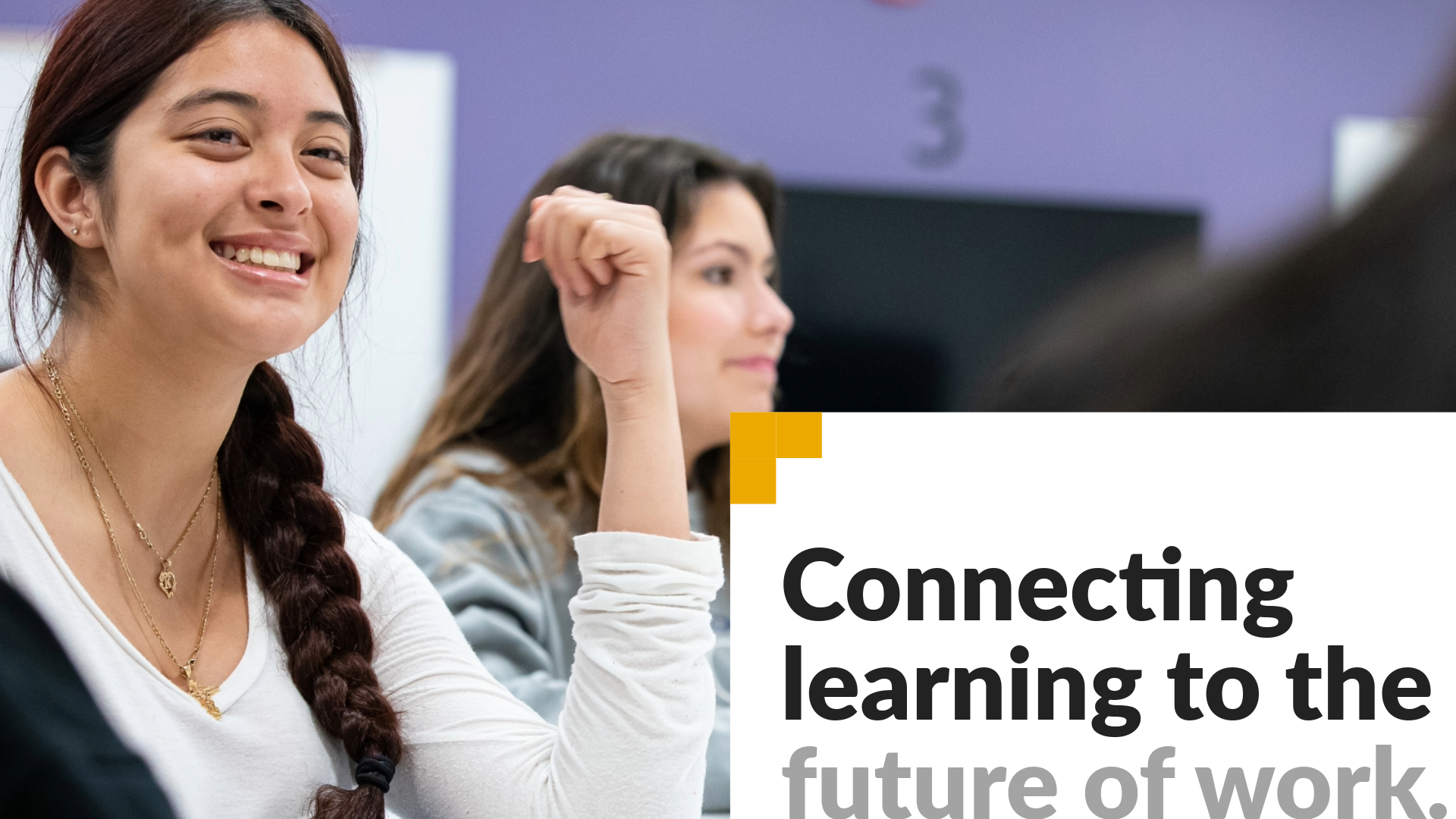 Connecting learning to the future of work. Image shows student smiling and looking off camera.