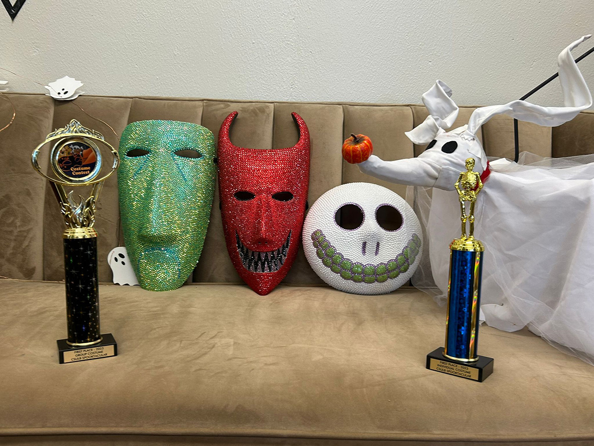 halloween masks and first-place trophies