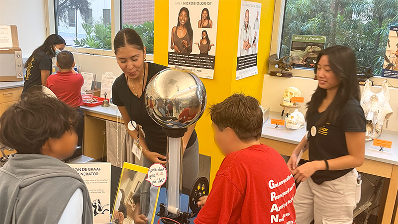 young children interacting with a science activity