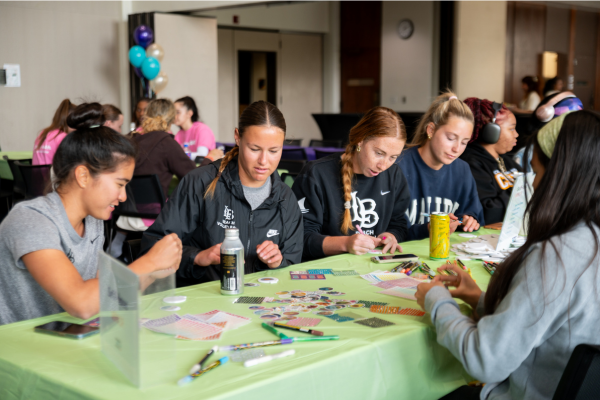 A table of women at the Women's History Month kick-off event in March 2024