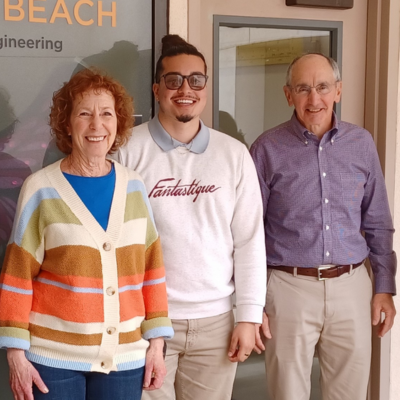 Jo Anne Charmack (left) and her husband, Scott, stand with Christopher Perez (center) Jo Anne Charmack (left) and her husband, Scott, stand with Christopher Perez (center)