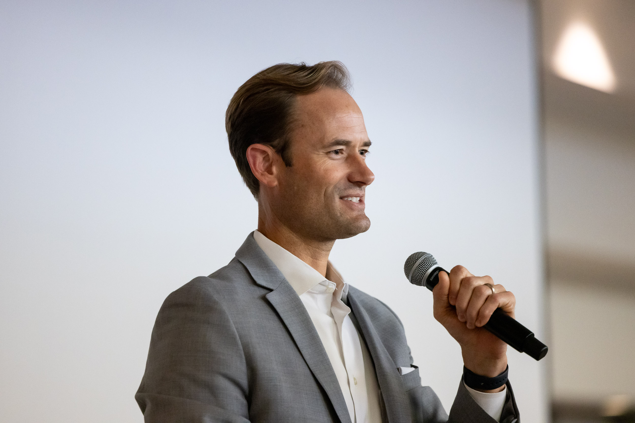 Sunstone Management CEO John Keisler holding microphone