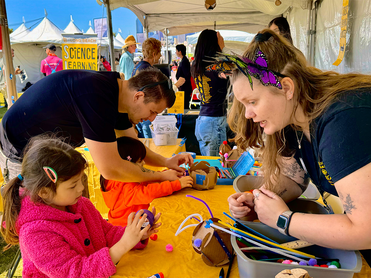 teachers guiding young children through science exploration activities