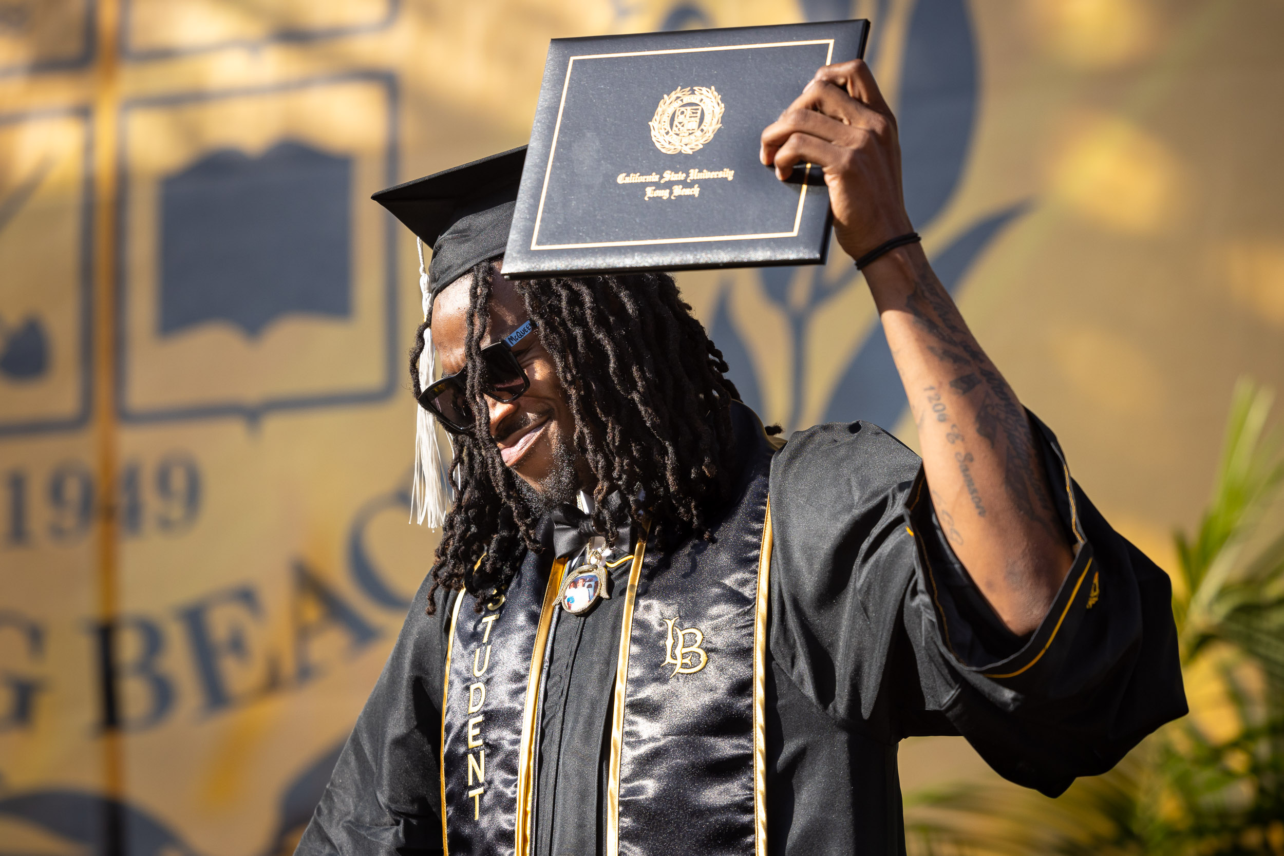 Student holds degree case at Commencement