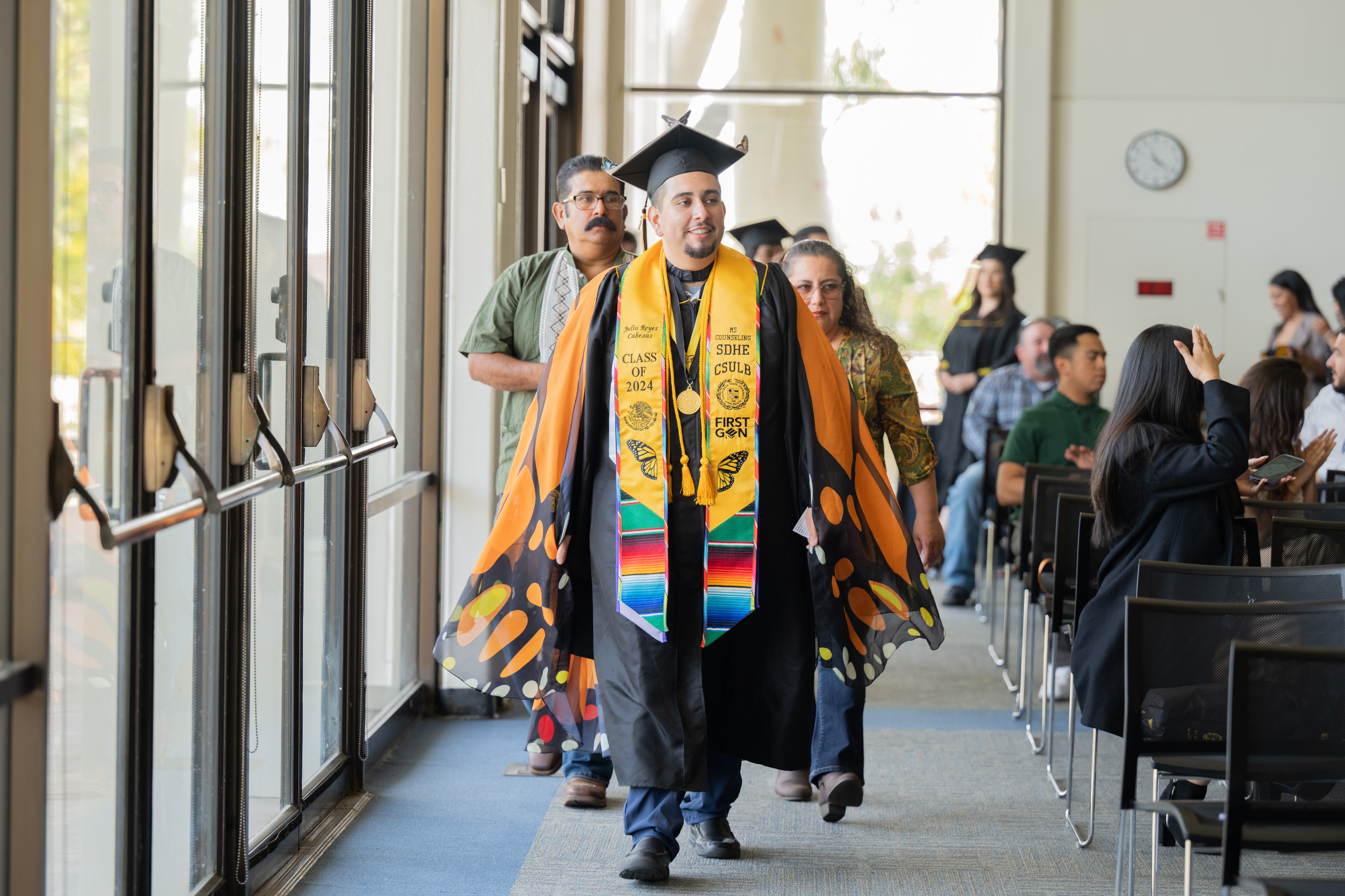 Graduate walking at the Undocu celebration Graduate walking at the Undocu celebration