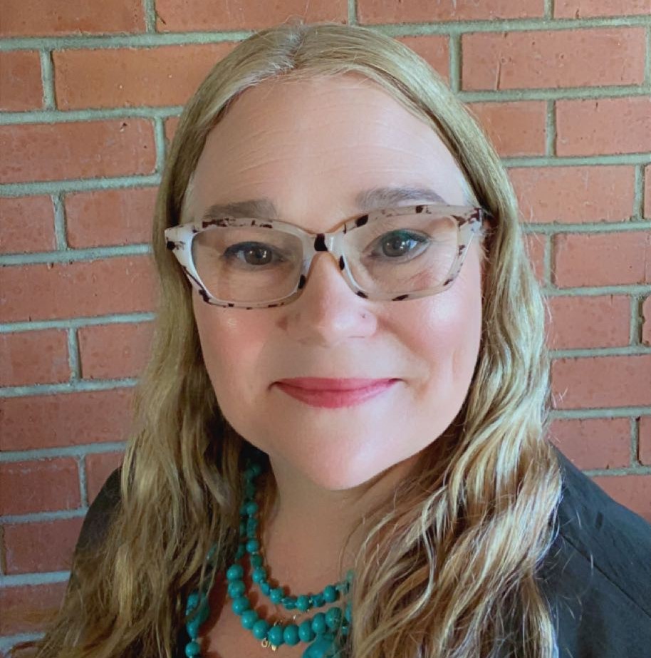 Headshot of librarian Michelle DeMars. Long blonde hair with eyeglasses and  wearing turquoise necklace. 