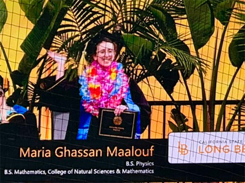 Maria receiving diploma