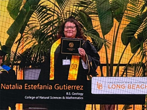 Natalia receiving diploma