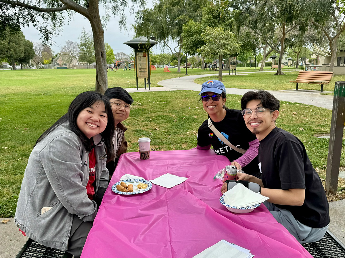 people seated at a picnic table