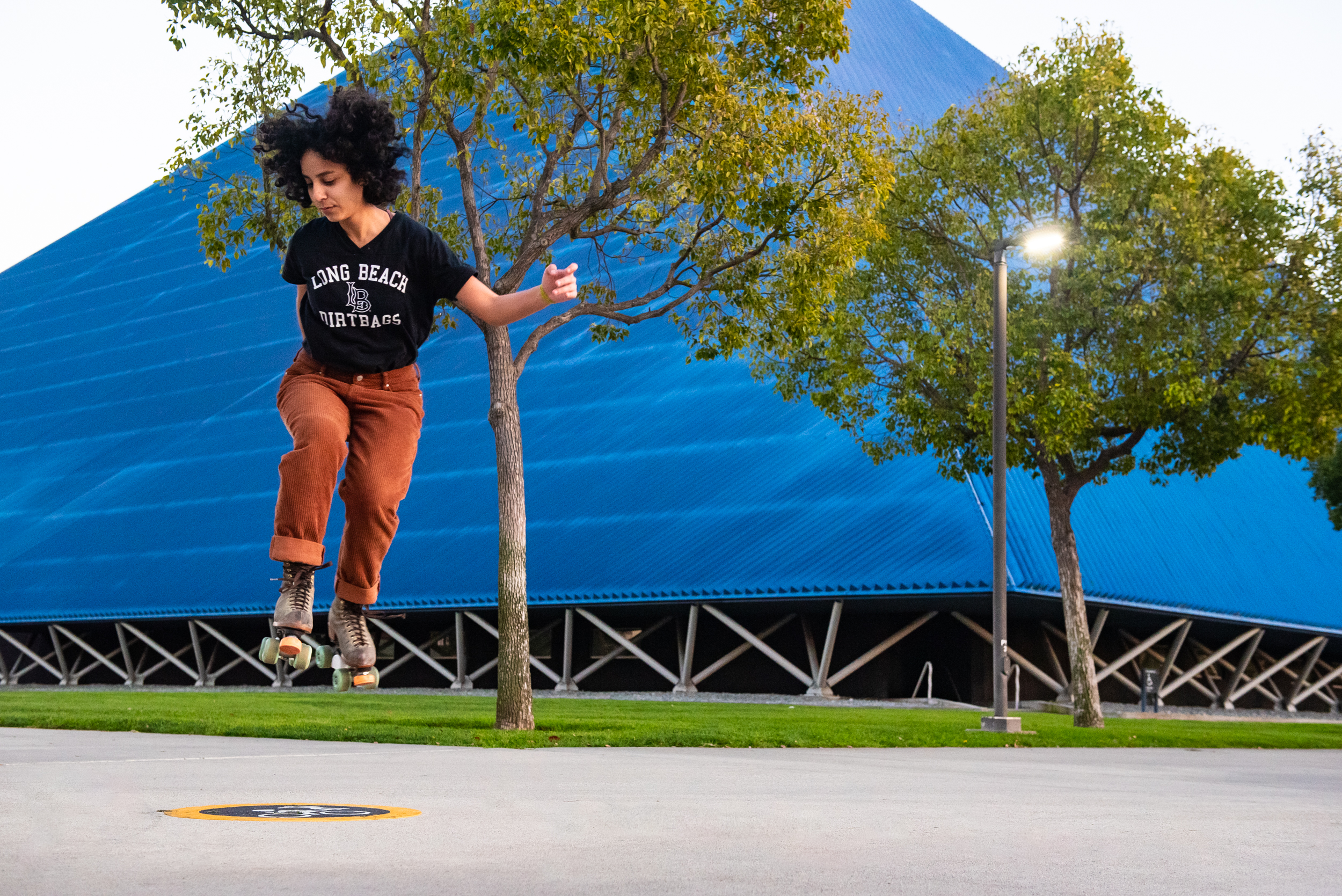 happy student playing with a skateboard