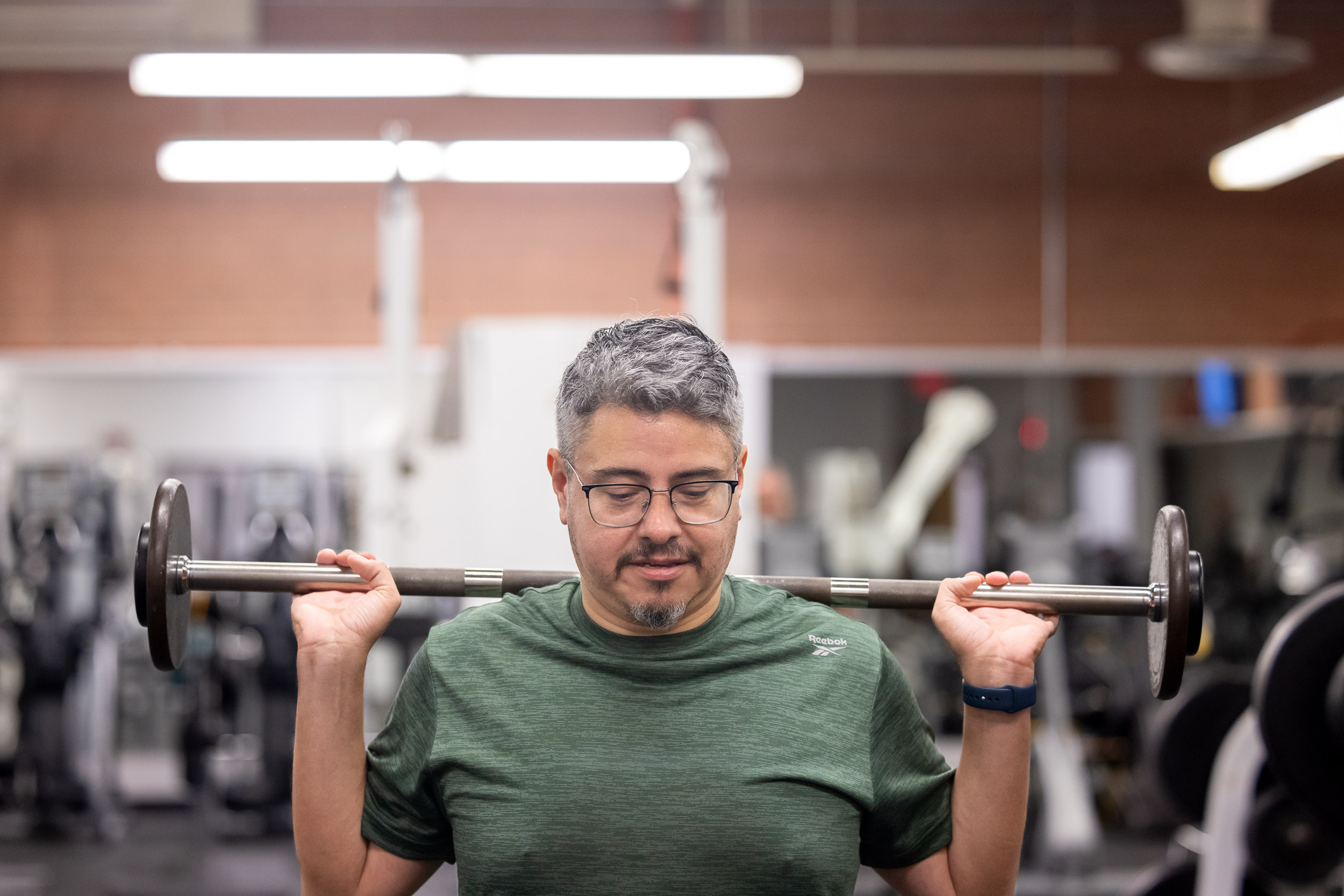 A man lifting weights at the LifeFit Center