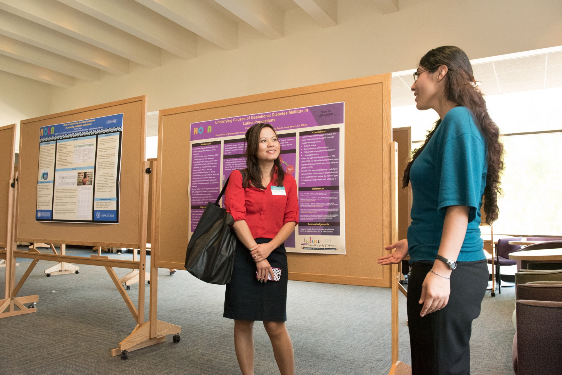 Students talking at poster presentation