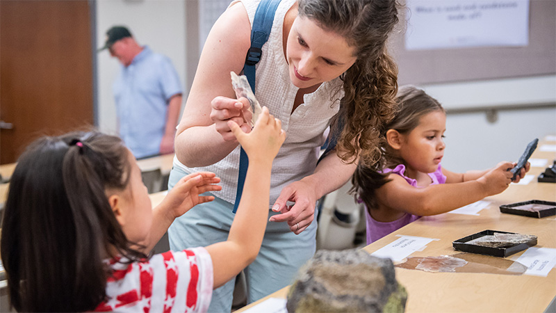young children examing crystals and rocks