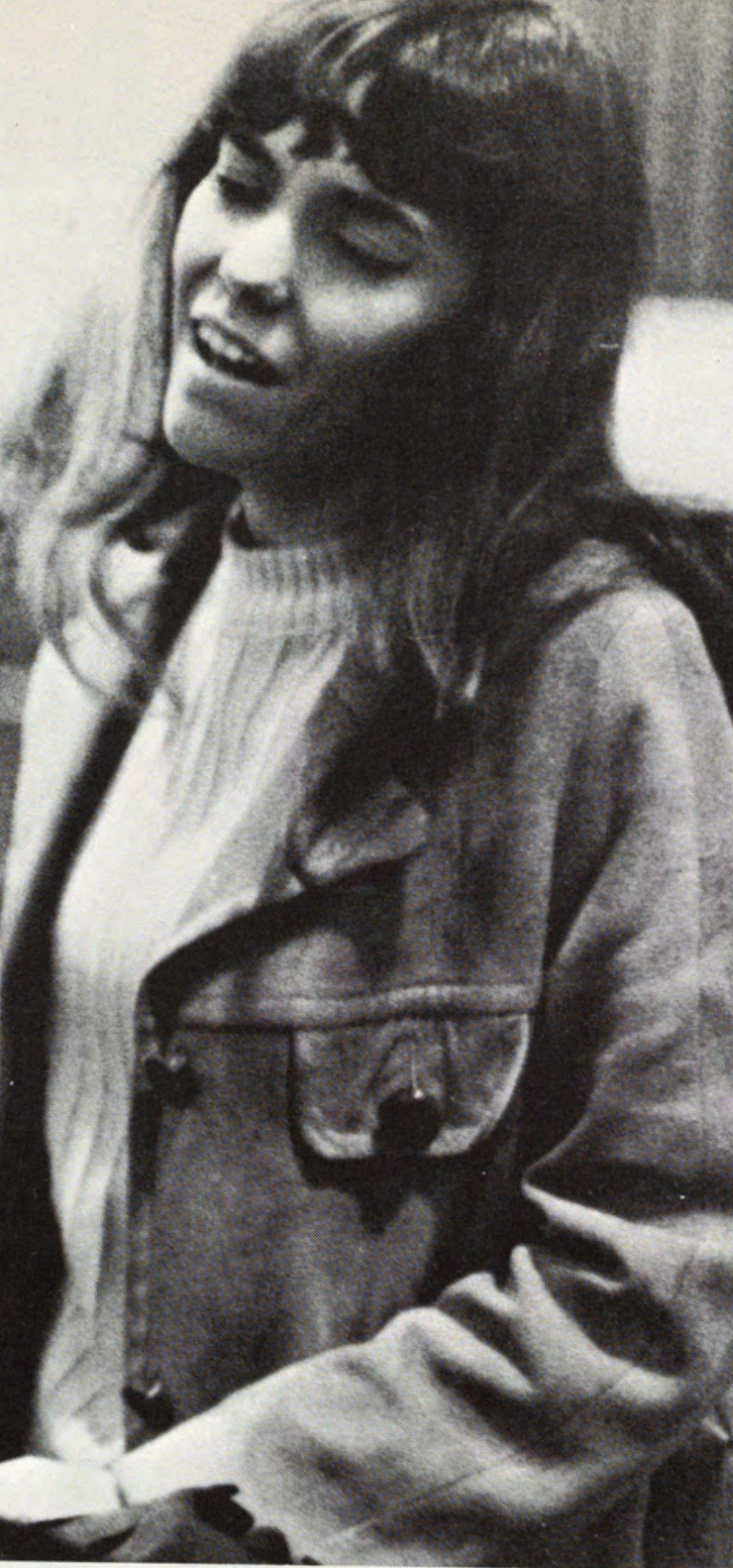 Karen Carpenter sings during a campus visit Karen Carpenter sings with her eyes closed.