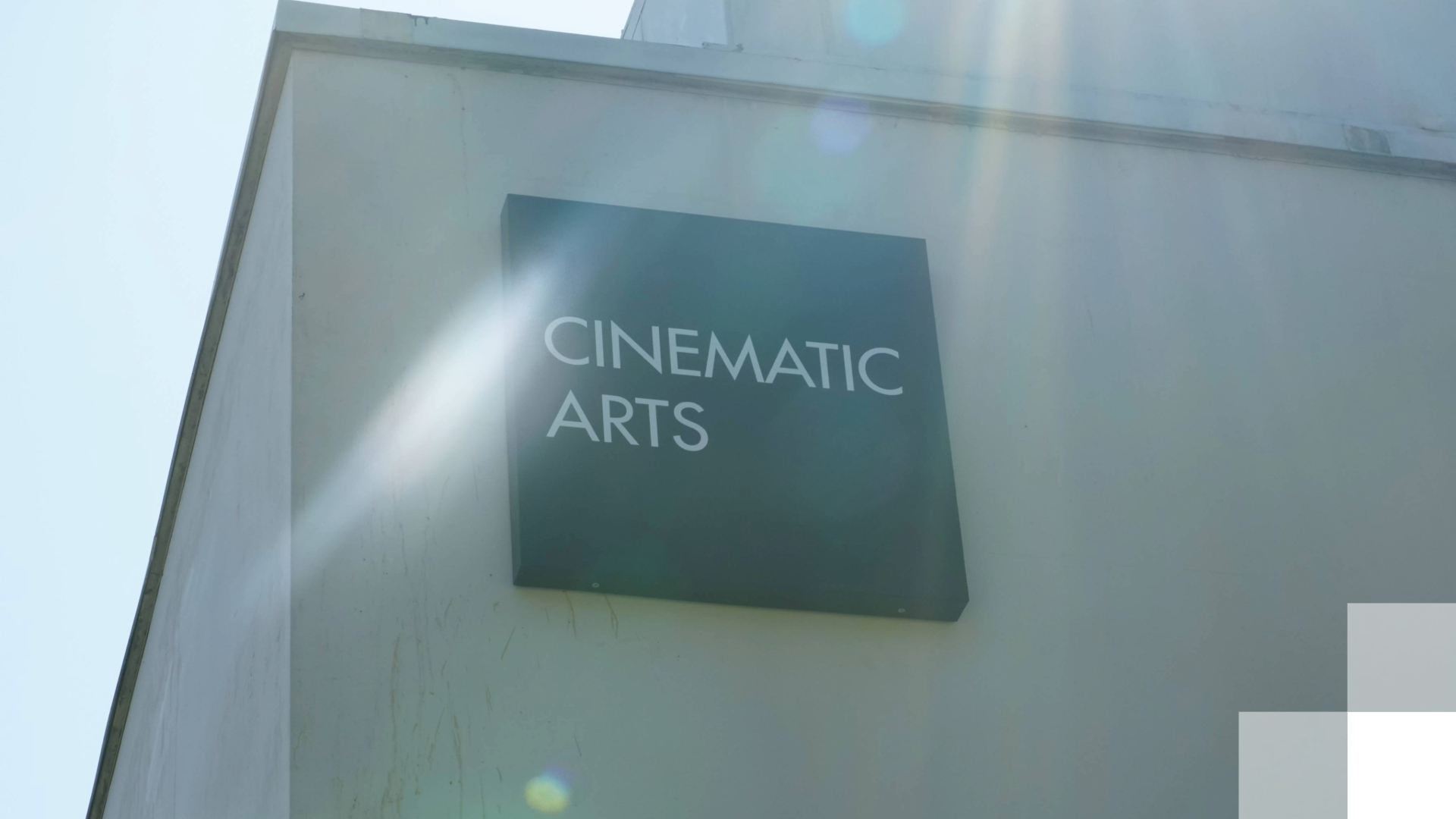Cinematic Arts Beach 2030 A sign of the side of a building reads "Cinematic Arts."