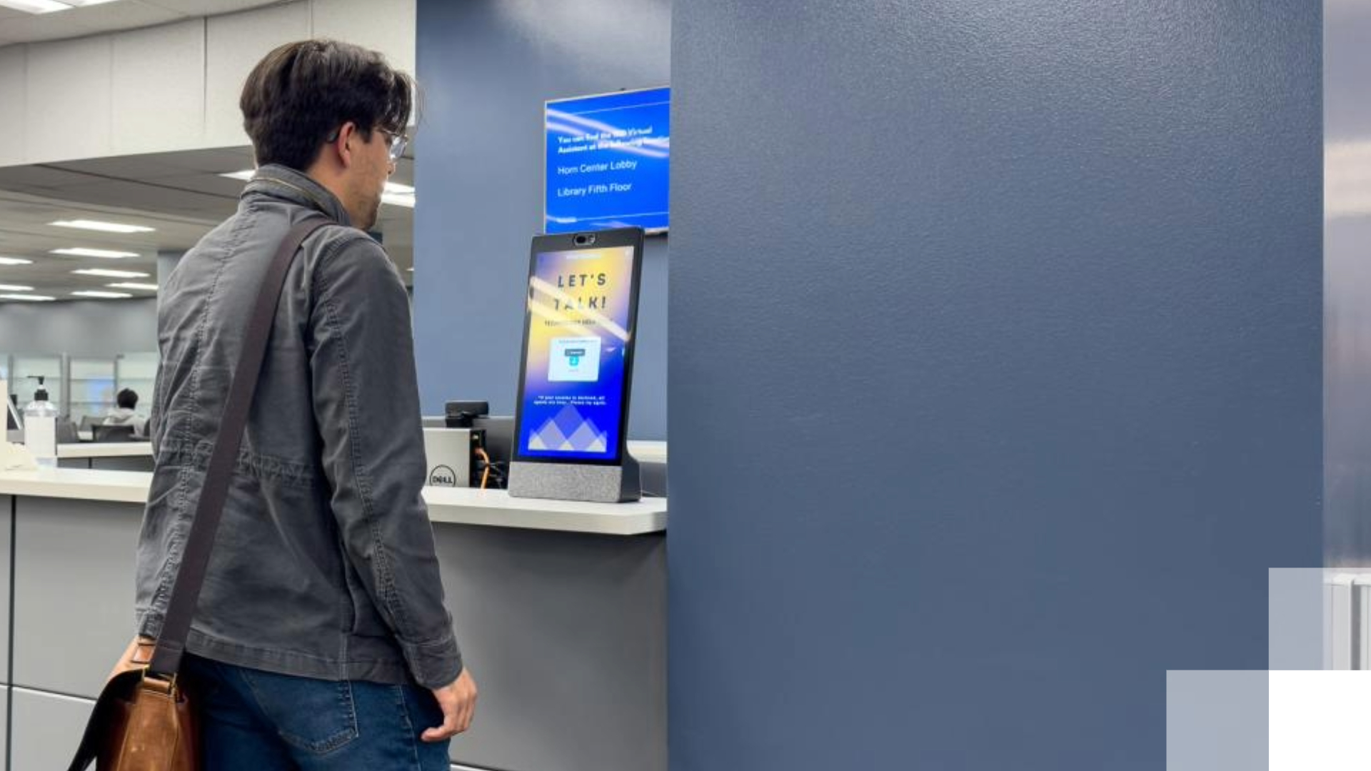 Virtual assistant - Beach 2030 A student stands in front of a virtual assistant tablet.