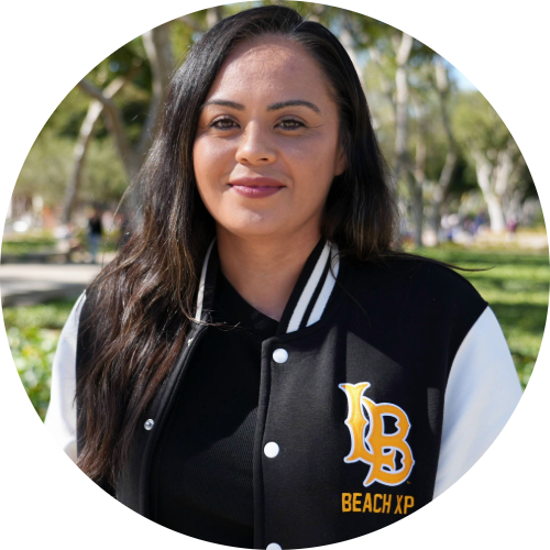 Michelle Ramirez Beach XP Staff members wearing black jacket smiles at camera.