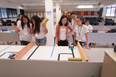 interns doing robotic design competition
