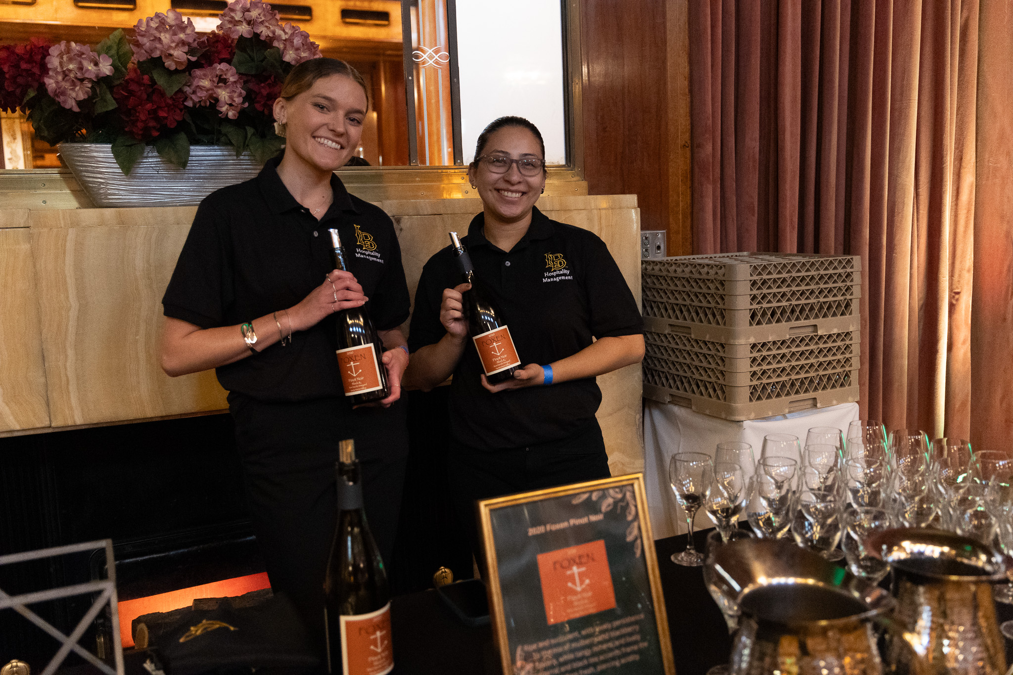 Students with wine bottles