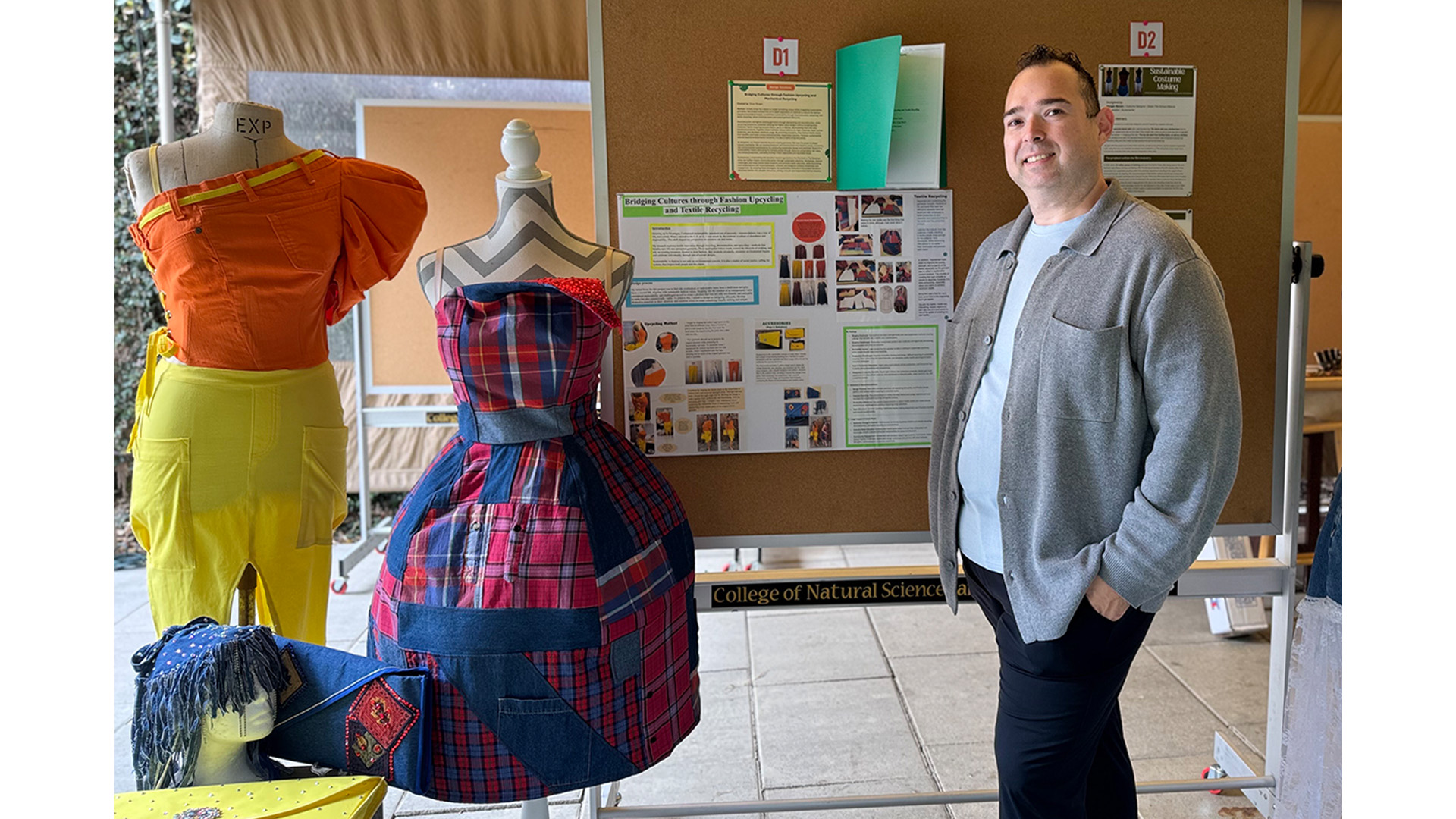 Student standing in by fashion project