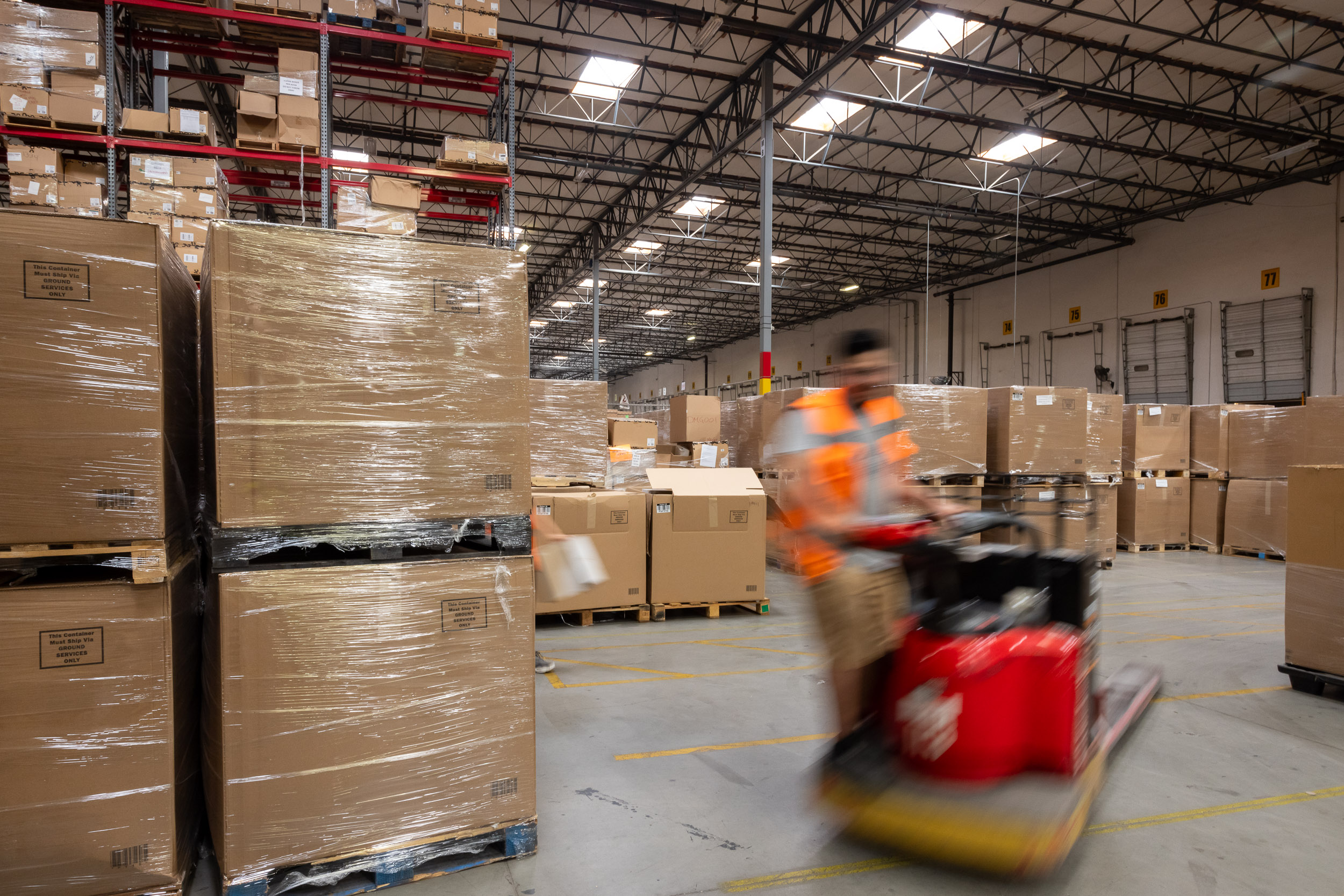 Man working a forklift in a warehouse