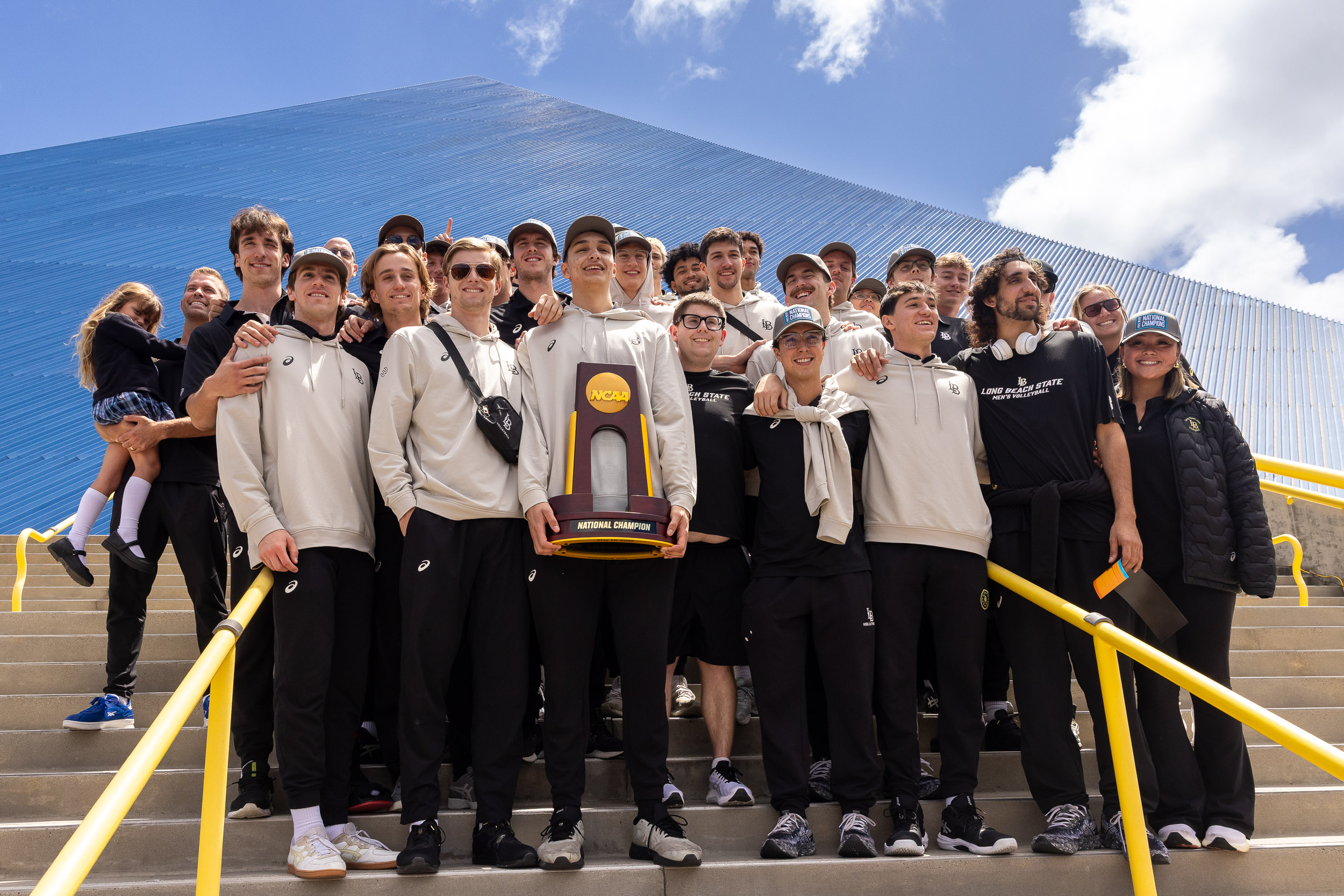 Men's Volleyball team with 2025 championship trophy