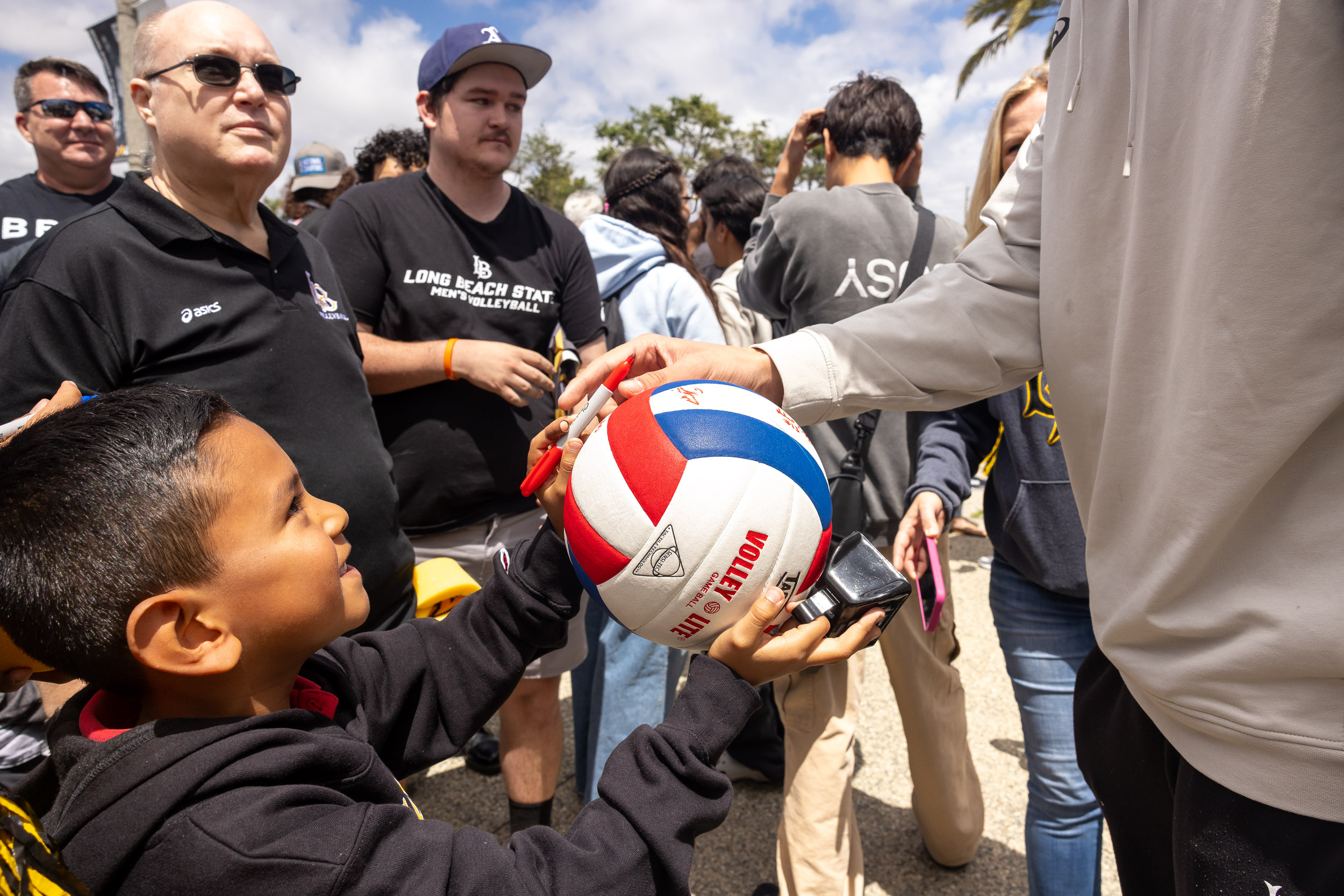 A boy with signed volleyball
