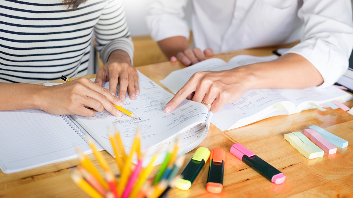 students dicussing written notes