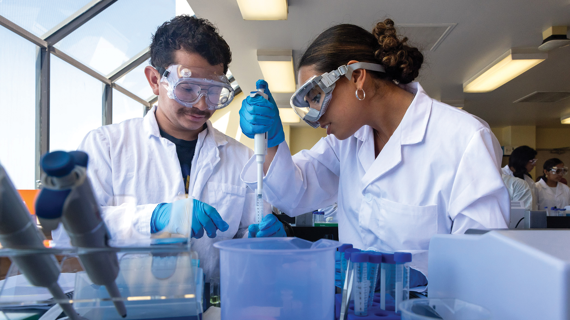 CSULB science students using a pipette