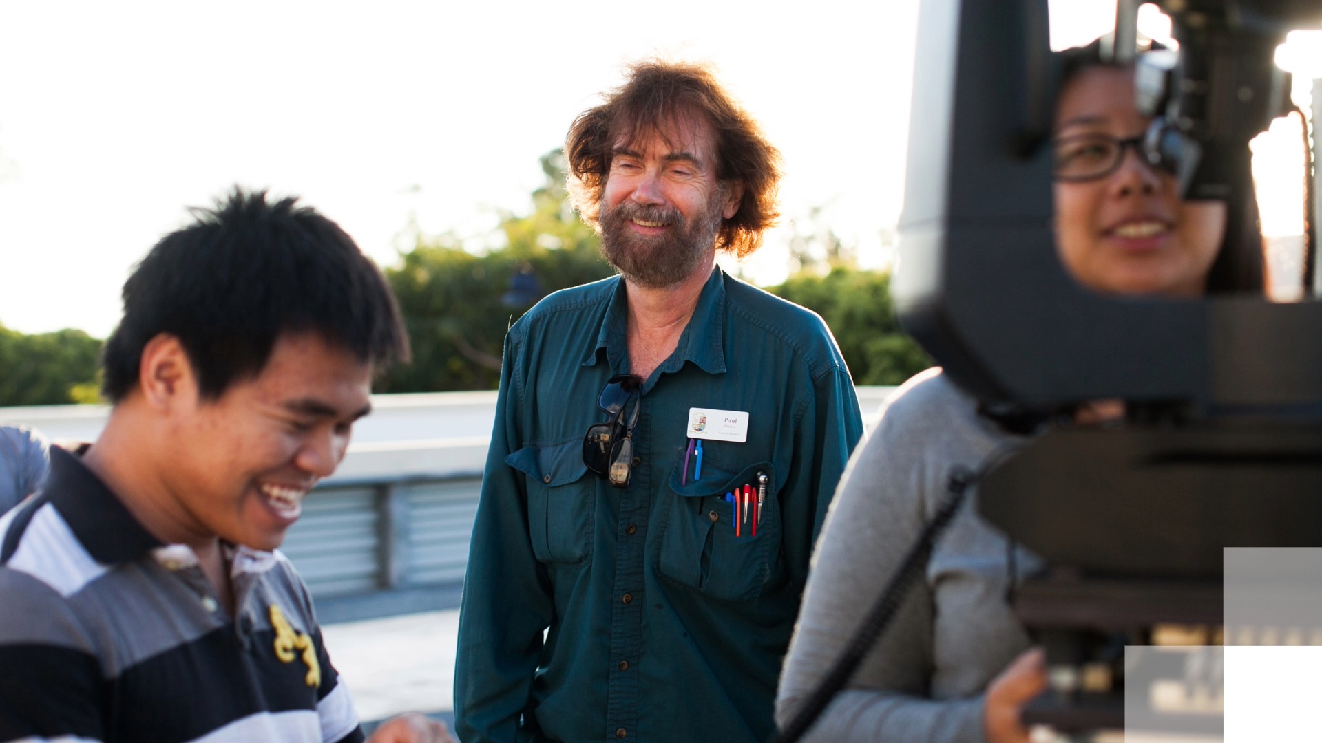 Faculty Appointment Guide publishes Group smiling and working with equipment outdoors