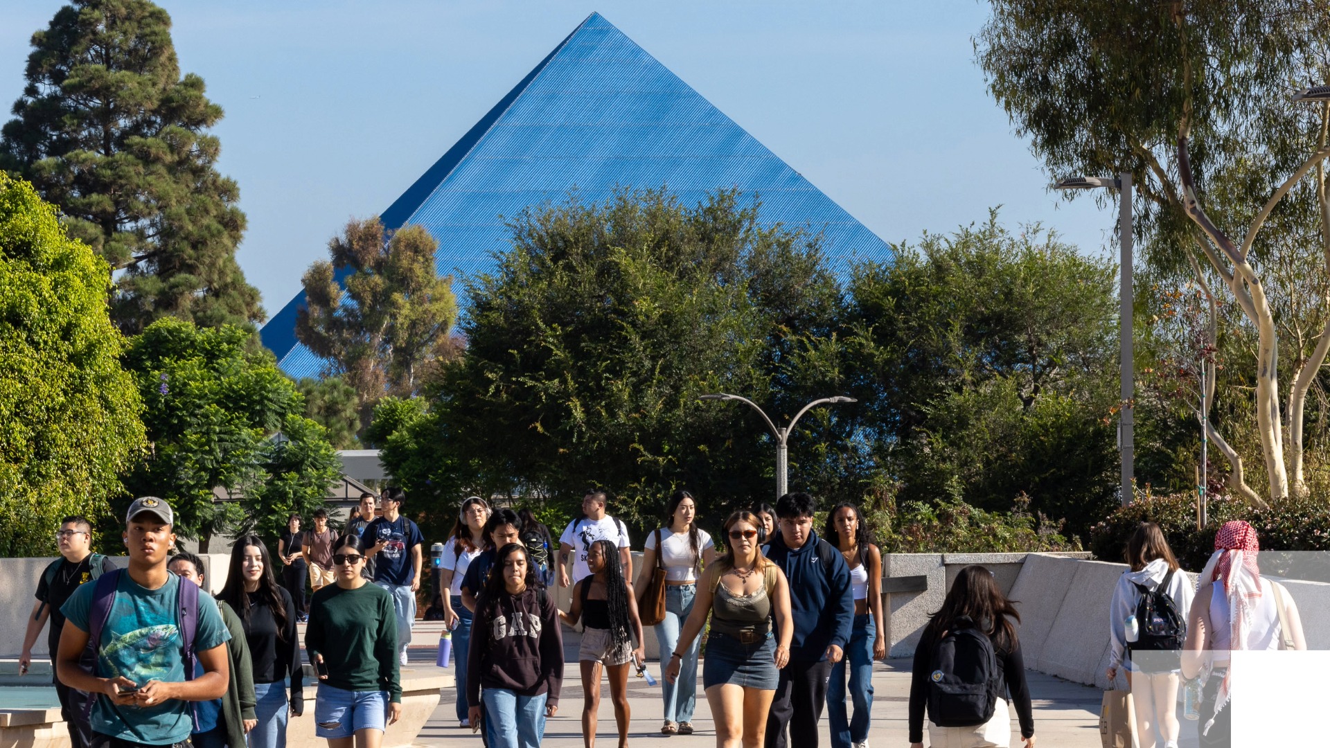 Future of Work initiative begins Students walking on campus with Walter pyramid in the background