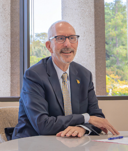 CSULB President Andrew Jones '82 seated at a table