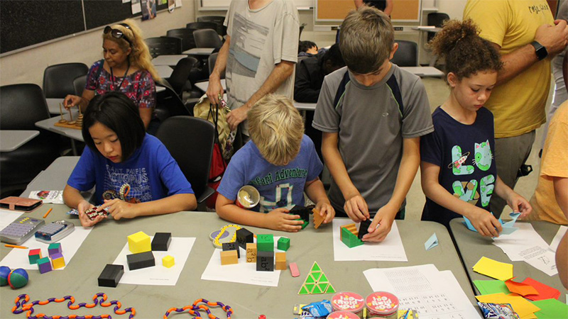 children focused on math puzzles