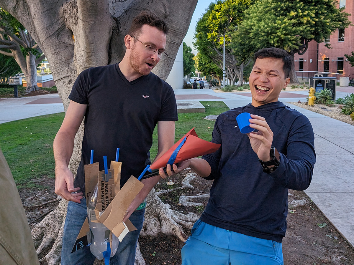 physics demonstration with rockets made from plastic bottles and cardboard fins