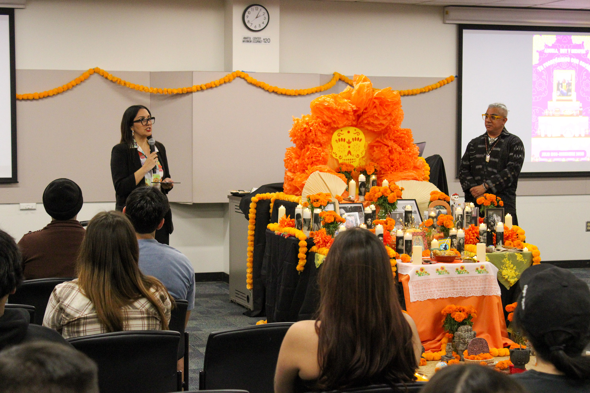 CSULB faculty member Felicia Montes with ofrenda CSULB faculty member Felicia Montes with ofrenda