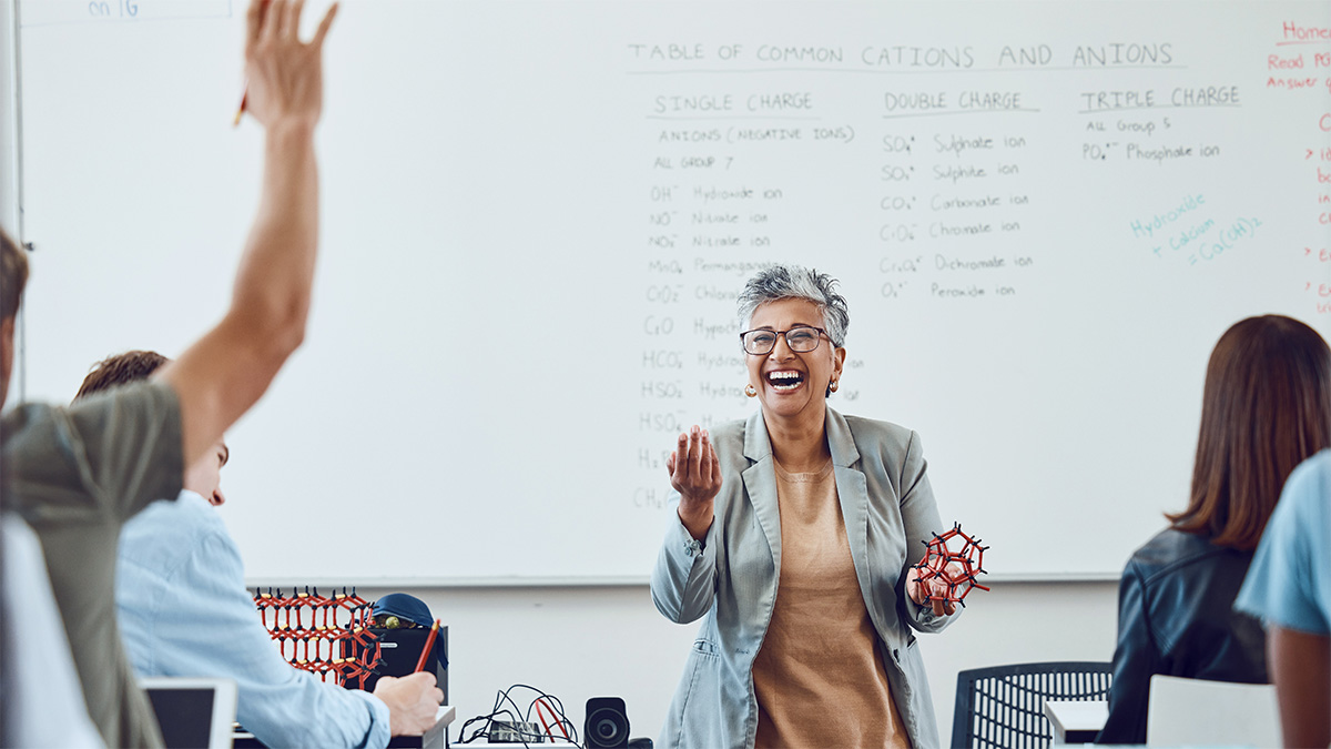 science teacher calling on student with raise hand