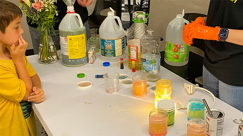 child watching home-made lava lamp