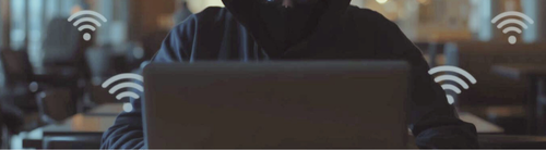 Safe Wifi tips Man sitting behind a laptop
