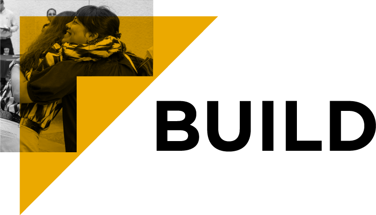 People hugging next to the word "build"